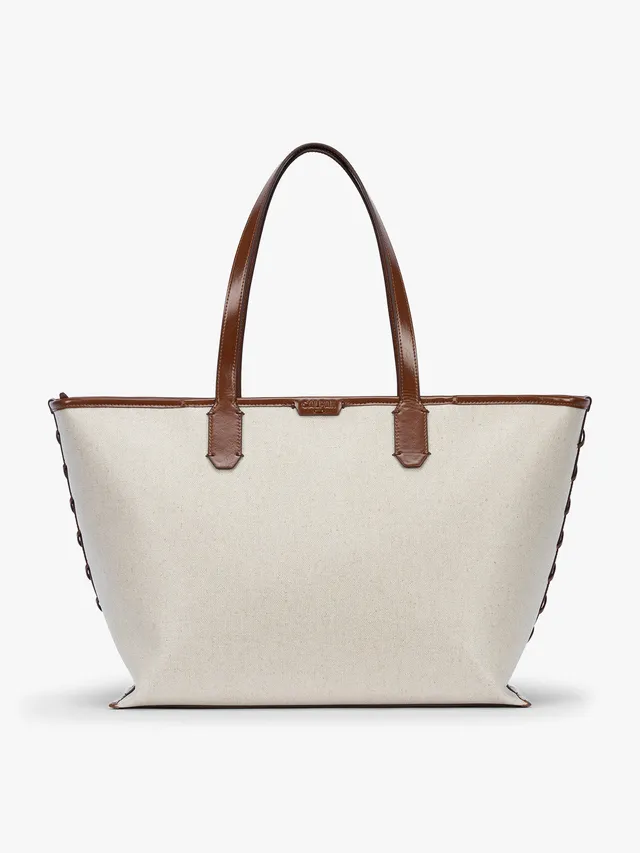 calpak-colette-15-canvas-laptop-tote-with-padded-sleeve-and-trolley-pass-through image 1
