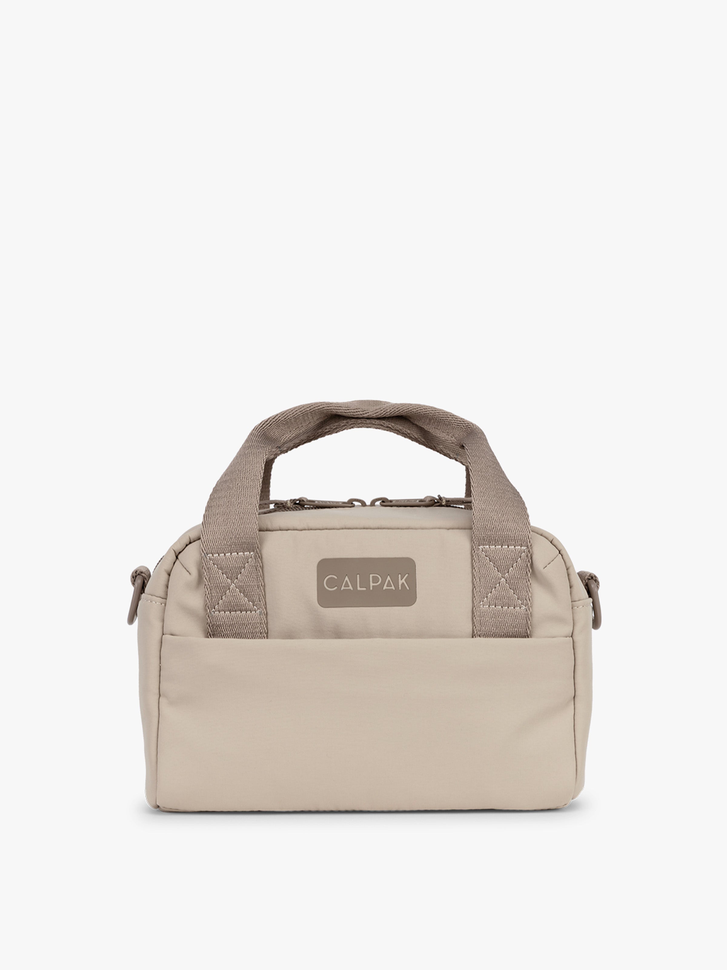 calpak-connect-crossbody-bag-compact-travel-crossbody-with-trolley-sleeve-and-fr image 1