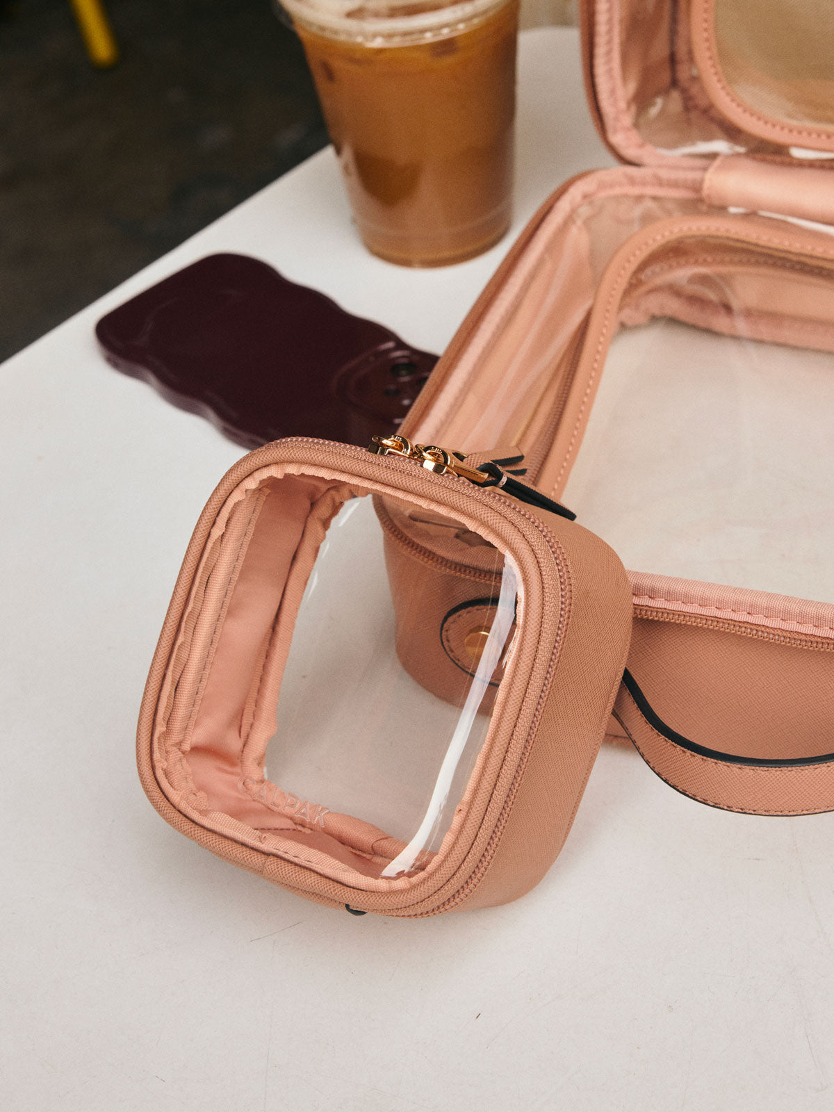 calpak-tiny-clear-cosmetics-case-mini-clear-travel-makeup-bag-with-zip-around-op image 2
