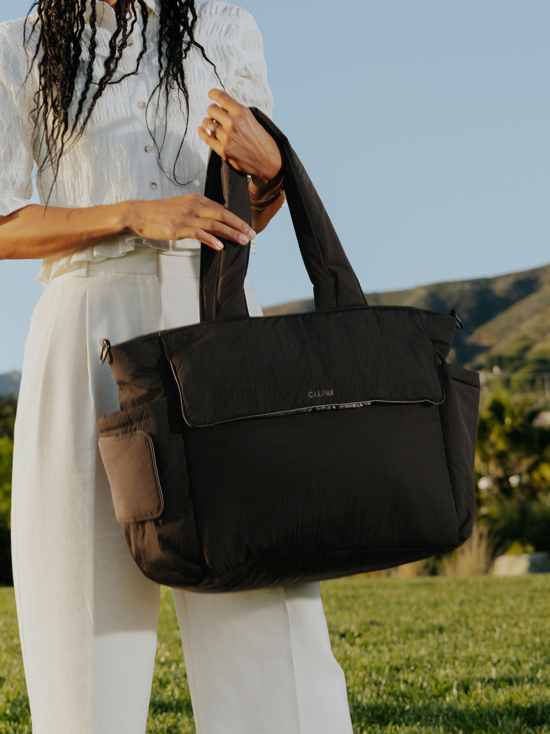 calpak-diaper-tote-bag-with-laptop-sleeve-insulated-bottle-pockets-luggage-sleev image 2