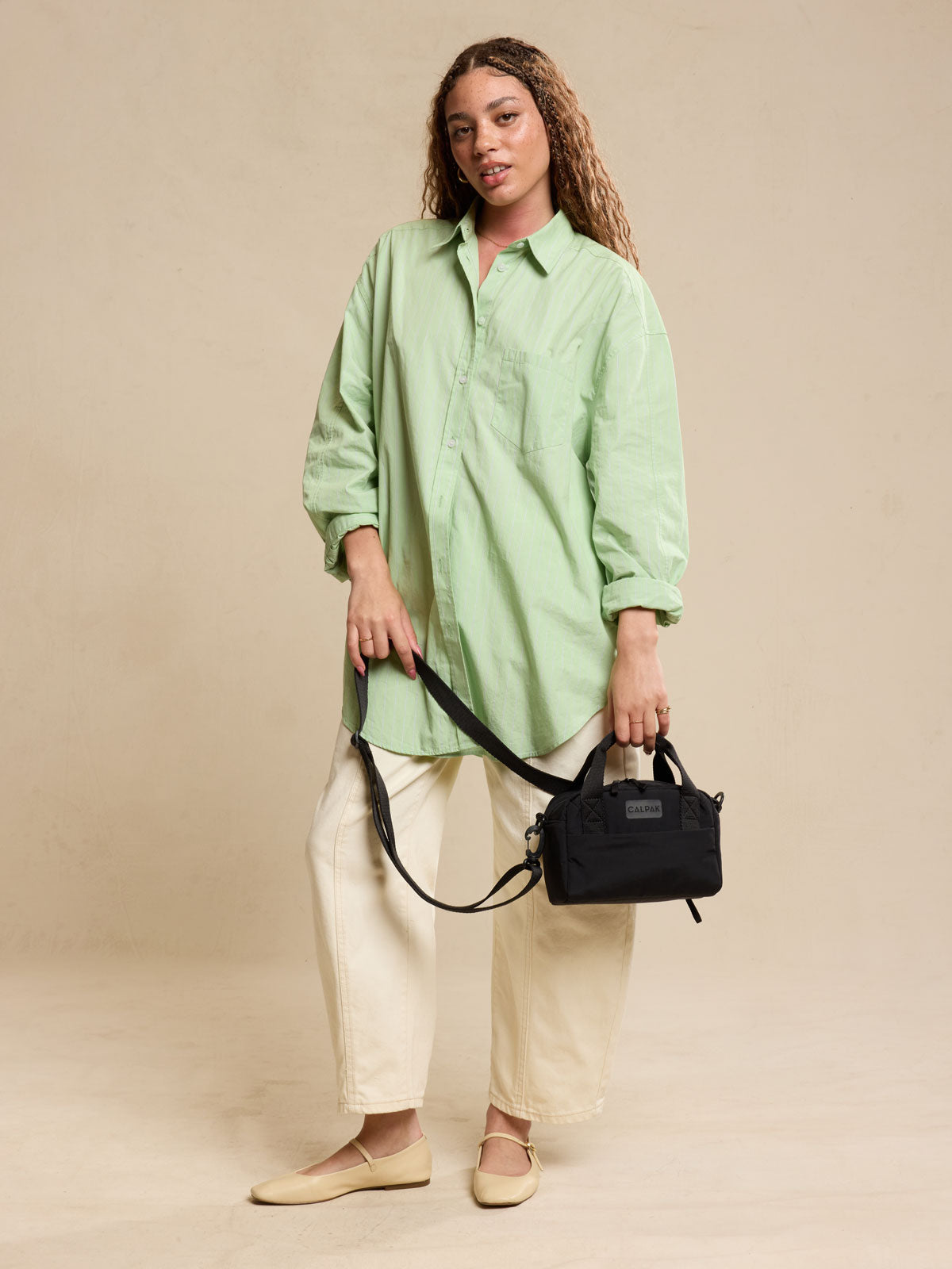 calpak-connect-crossbody-bag-compact-travel-crossbody-with-trolley-sleeve-and-fr image 7